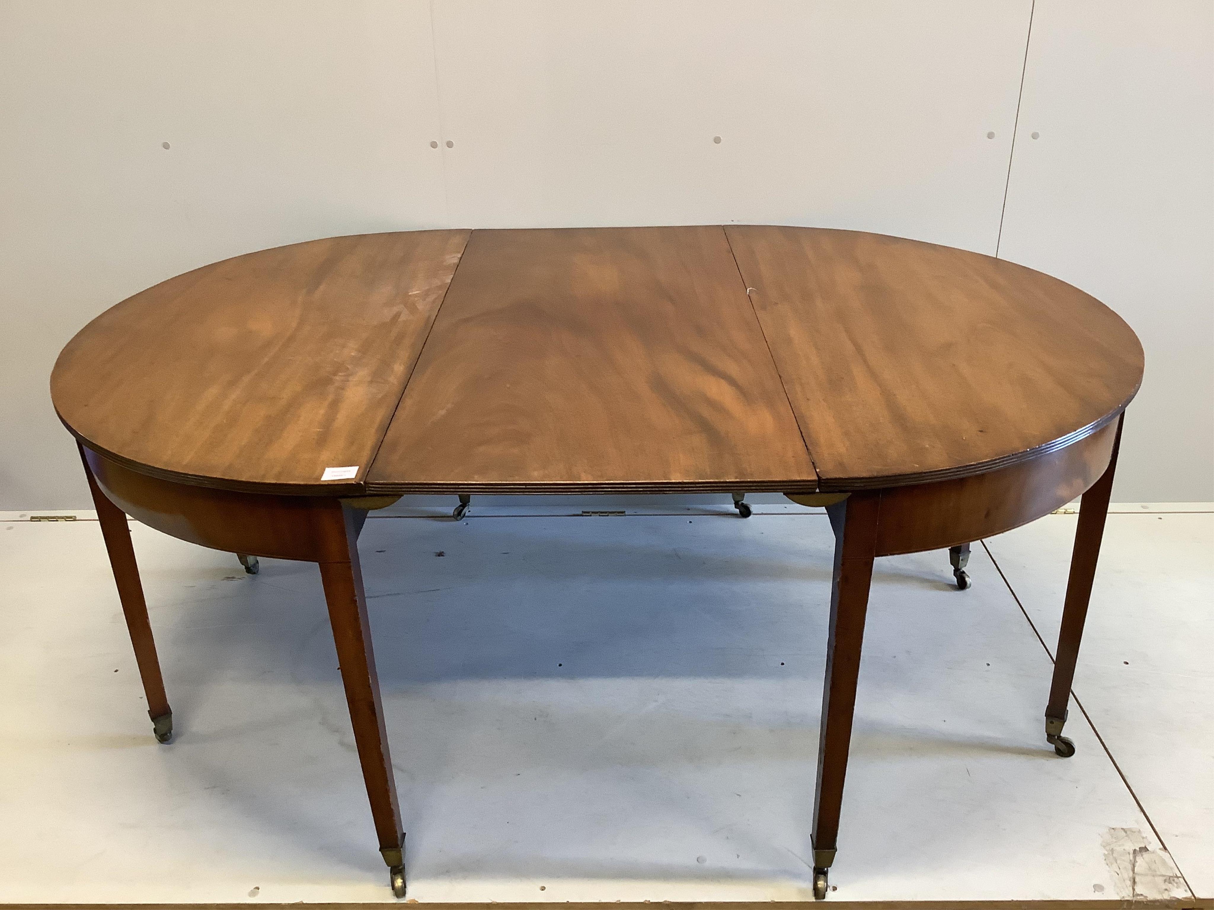 A George III mahogany D end dining table, with one leaf, width 122cm, extends to 175cm, height 70cm. Condition - a little faded otherwise fair to good condition